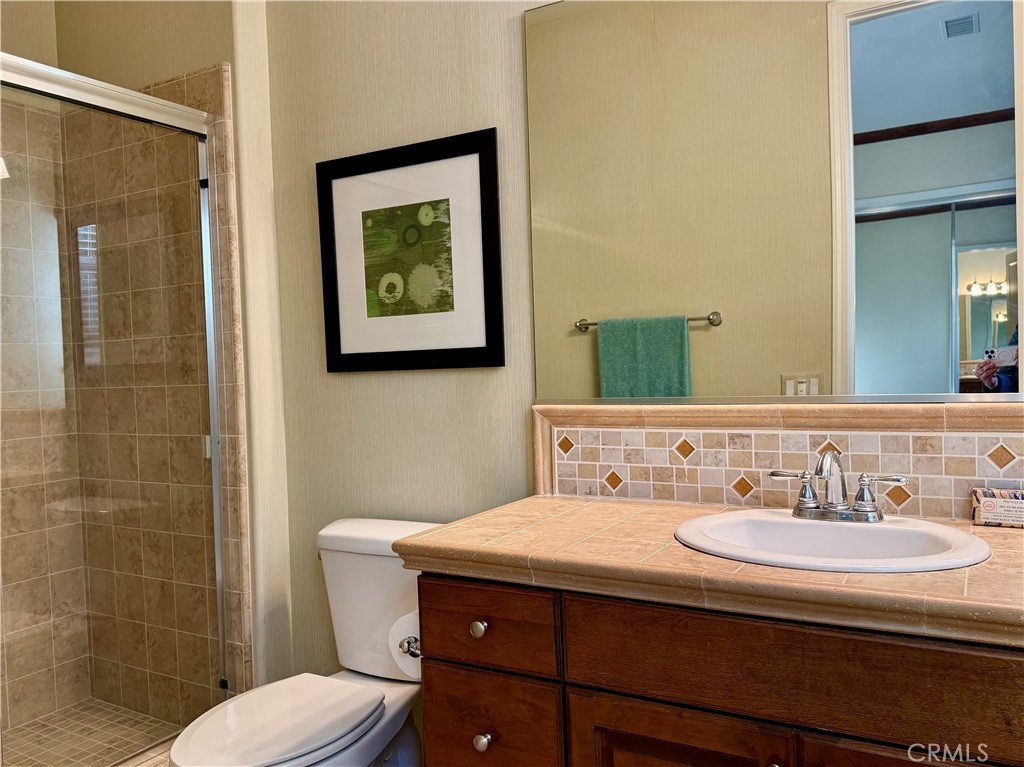 20318 West Vía Urbino Porter Ranch, CA 91326 - Photo 19 of 34 a bathroom with a sink and a mirror