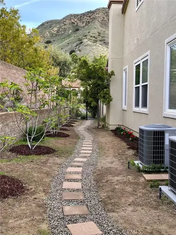 an aerial view of a house with outdoor space