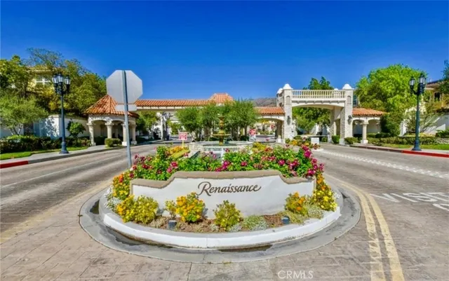 a row of palm trees and swimming pool in the backyard of a house