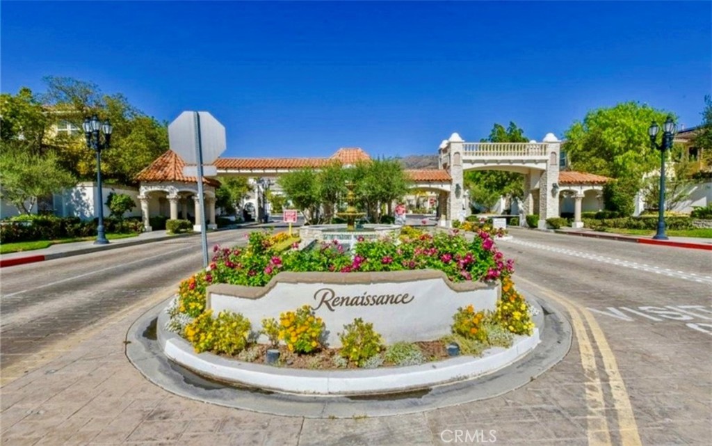 20318 West Vía Urbino Porter Ranch, CA 91326 - Photo 30 of 34 a view of a swimming pool with a dining table and chairs