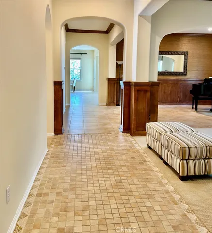 a bedroom with furniture and a mirror