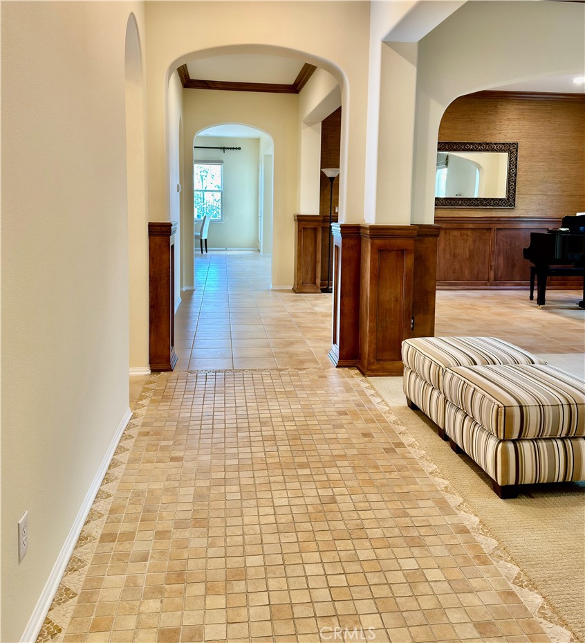 20318 West Vía Urbino Porter Ranch, CA 91326 - Photo 5 of 34 a bedroom with furniture and a mirror