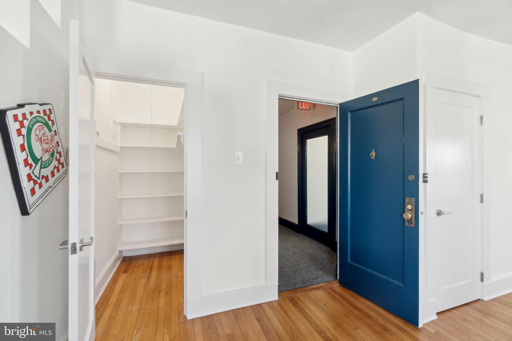 1901 Columbia Road Northwest, Unit 805 Washington, DC 20009 - Photo 13 of 37 a view of a hallway with wooden floor and closet