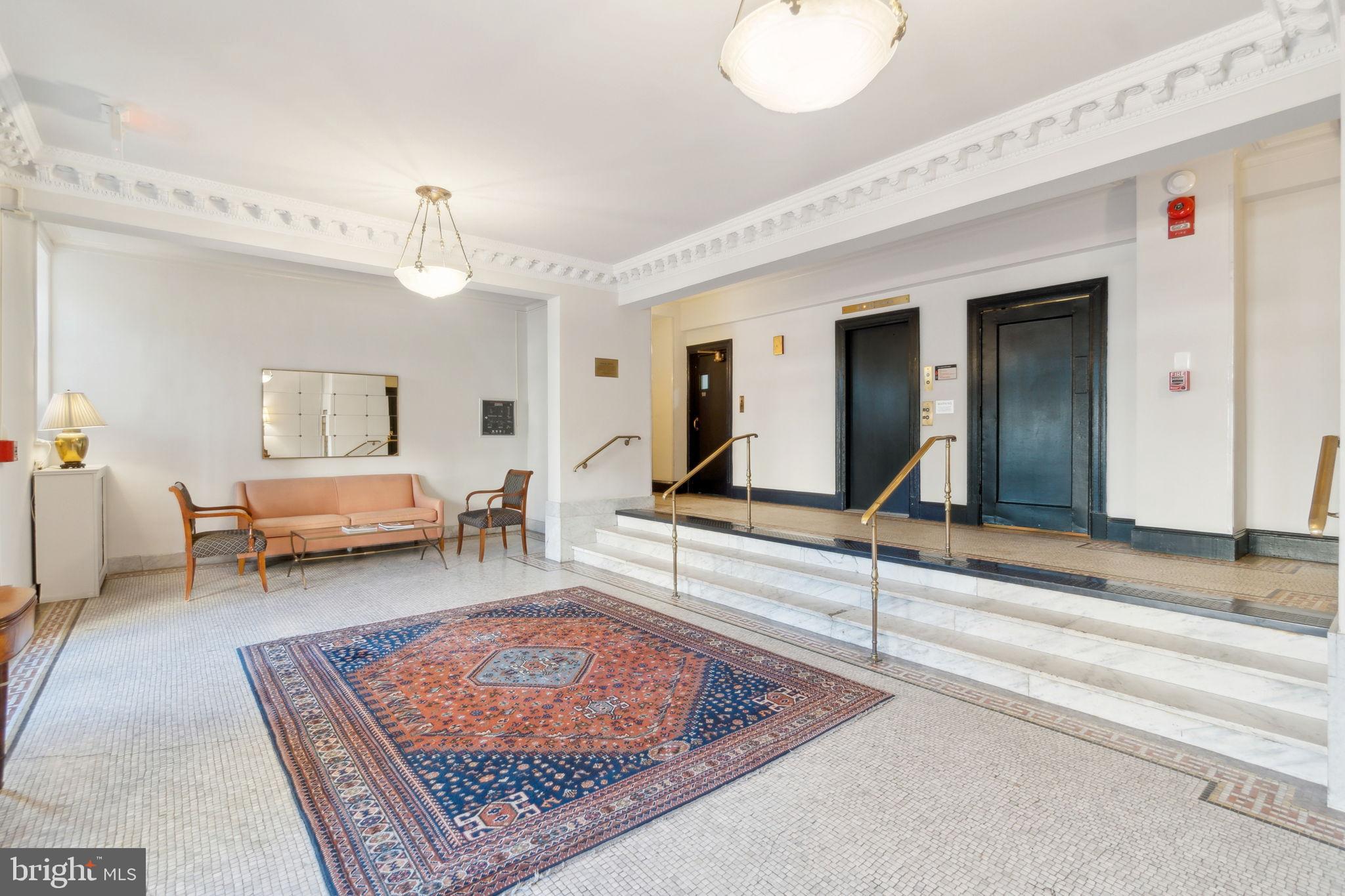1901 Columbia Road Northwest, Unit 805 Washington, DC 20009 - Photo 29 of 37 a living room with furniture and a rug