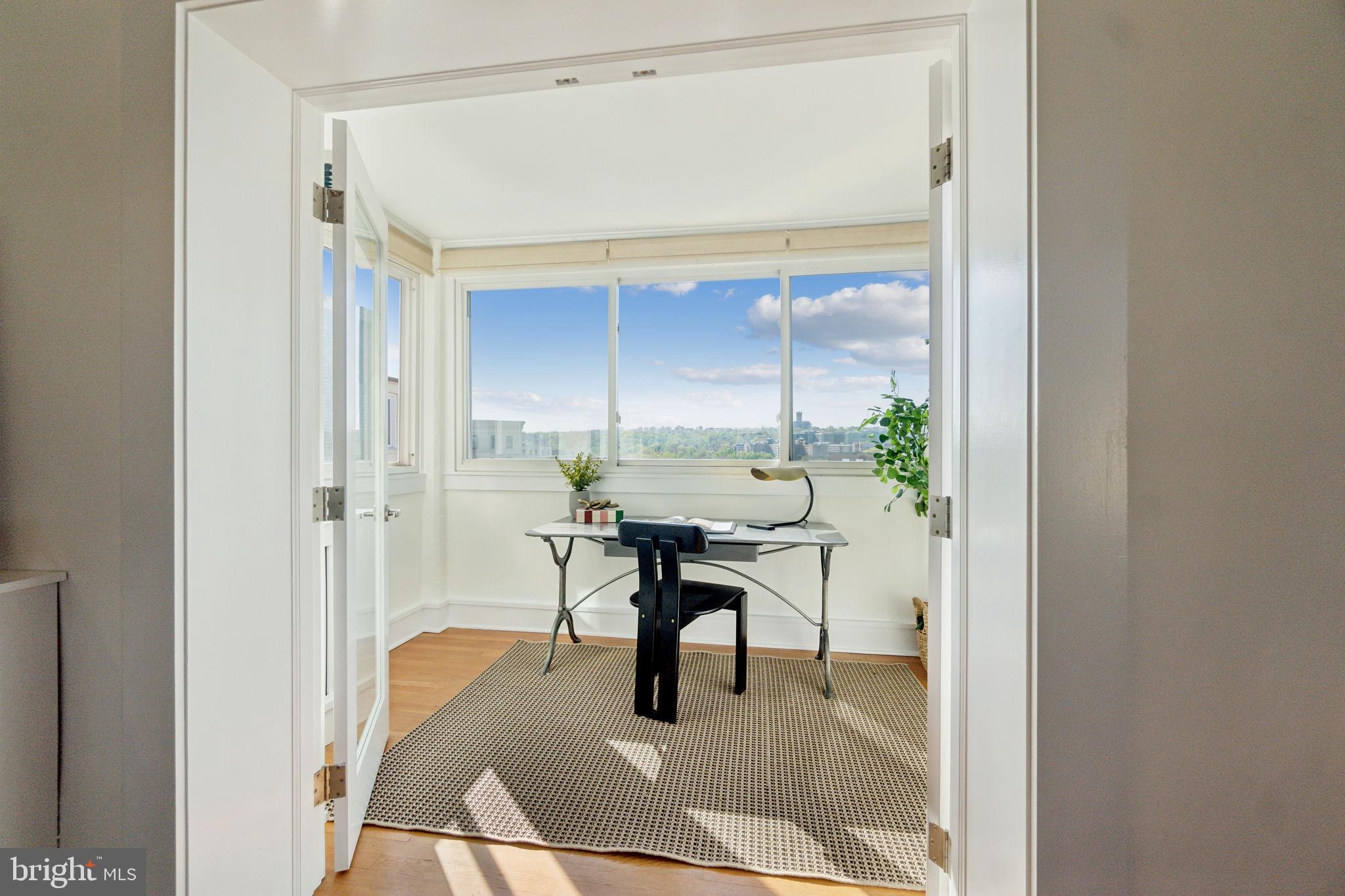 1901 Columbia Road Northwest, Unit 805 Washington, DC 20009 - Photo 7 of 37 a dining room with furniture and a table