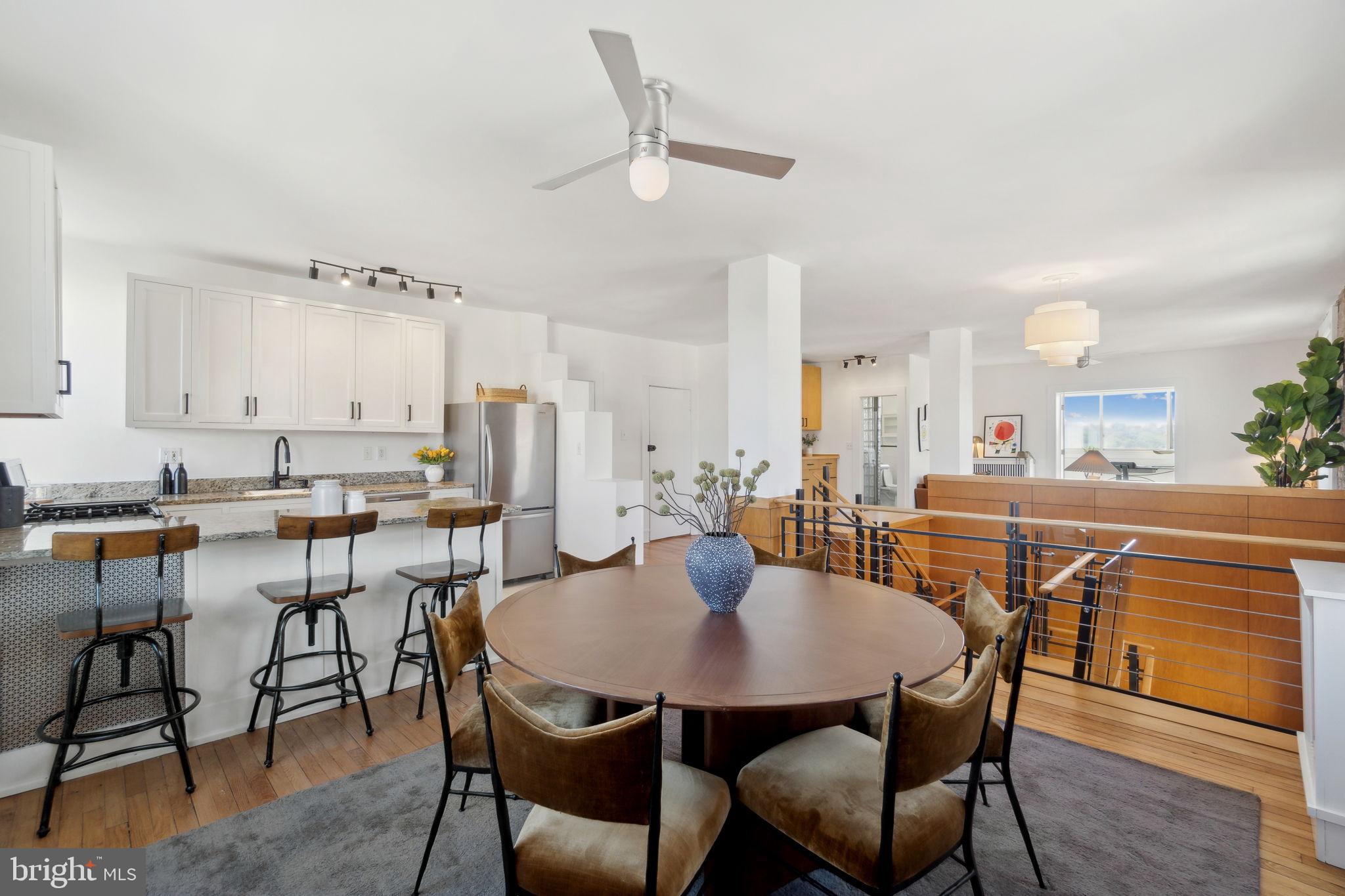 1901 Columbia Road Northwest, Unit 805 Washington, DC 20009 - Photo 10 of 37 a view of a dining room with furniture and wooden floor