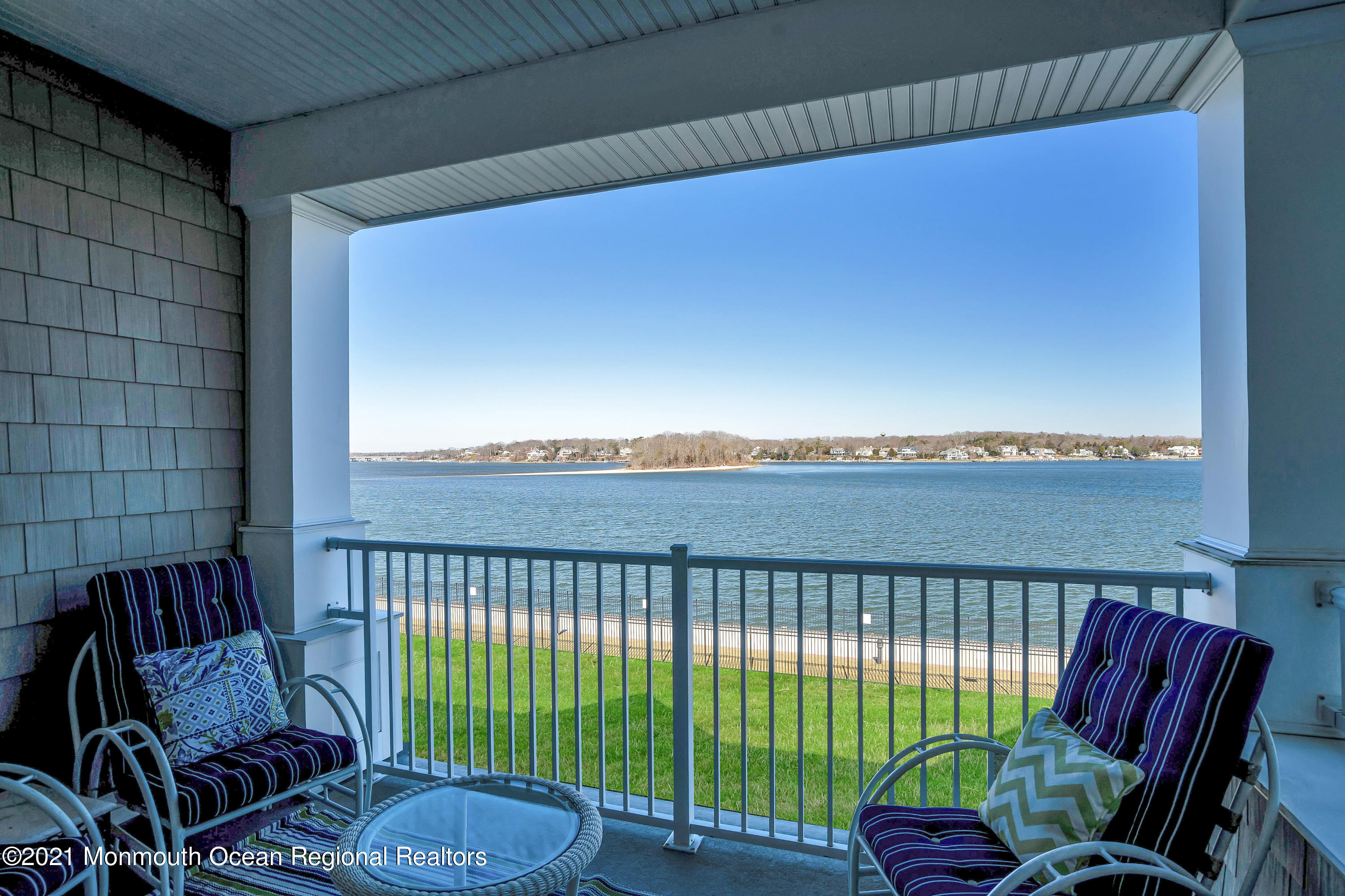 2201 River Road, Unit 3202 Point Pleasant, NJ 08742 - Photo 14 of 44 a balcony with table and chairs