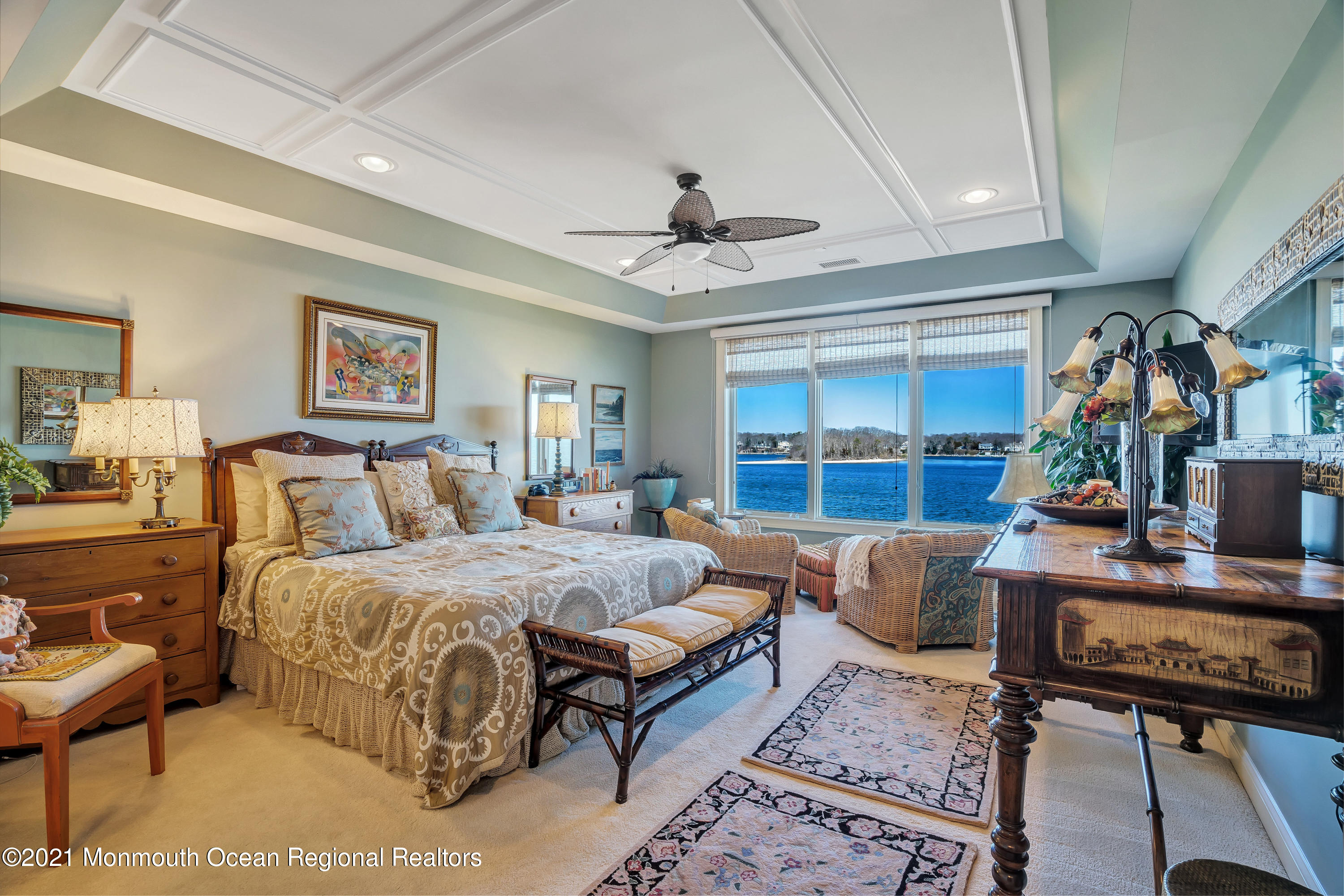2201 River Road, Unit 3202 Point Pleasant, NJ 08742 - Photo 18 of 44 a bedroom with a large bed a rug and chair