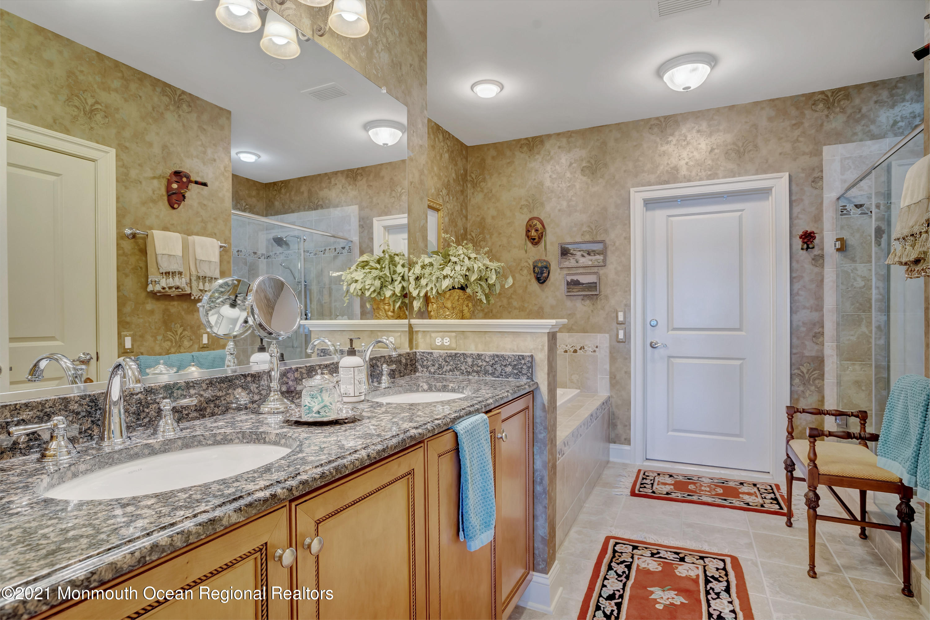 2201 River Road, Unit 3202 Point Pleasant, NJ 08742 - Photo 21 of 44 a bathroom with a granite countertop sink a mirror and a shower
