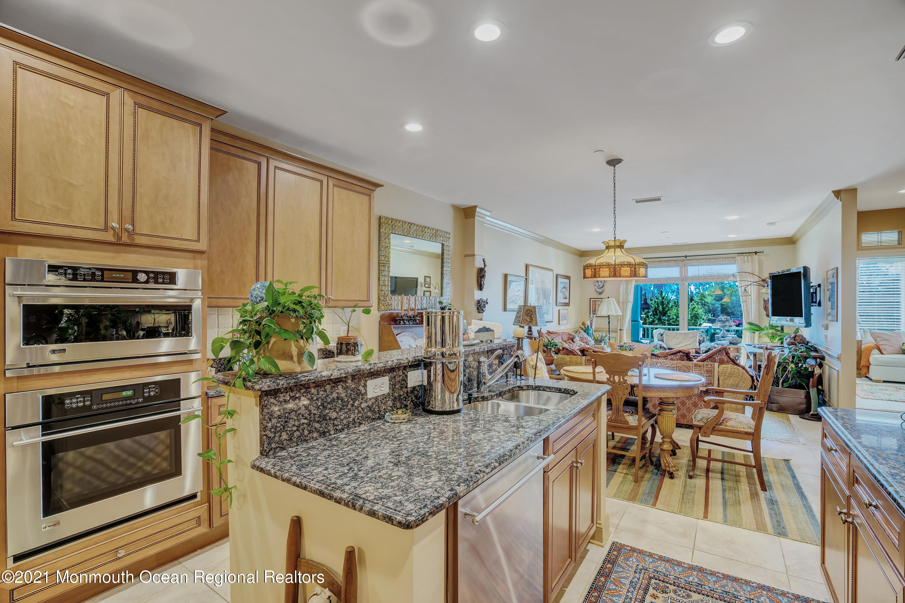 2201 River Road, Unit 3202 Point Pleasant, NJ 08742 - Photo 25 of 44 a kitchen with stainless steel appliances granite countertop a stove a sink and a refrigerator