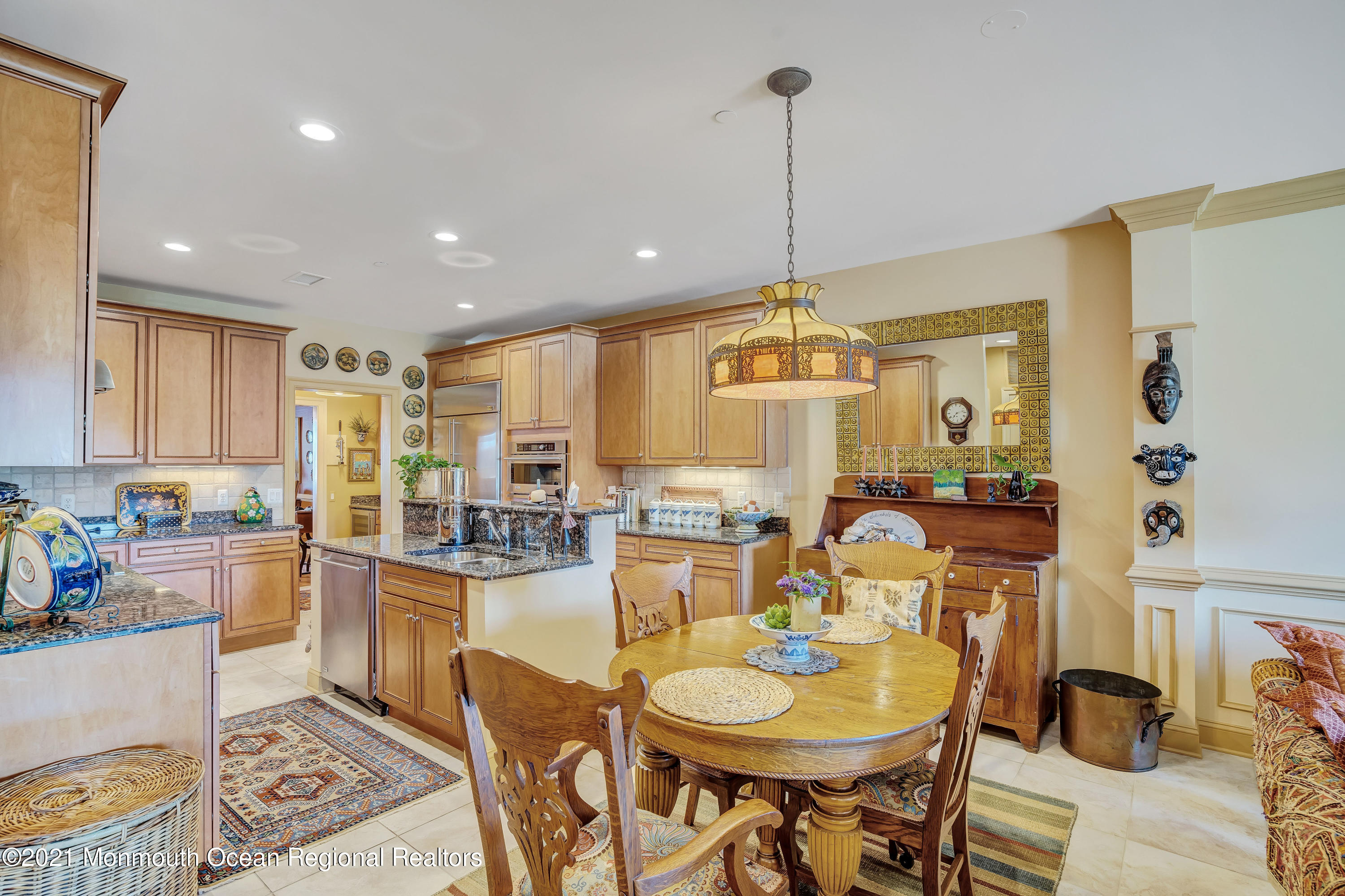 2201 River Road, Unit 3202 Point Pleasant, NJ 08742 - Photo 29 of 44 a kitchen with sink refrigerator dining table and chairs