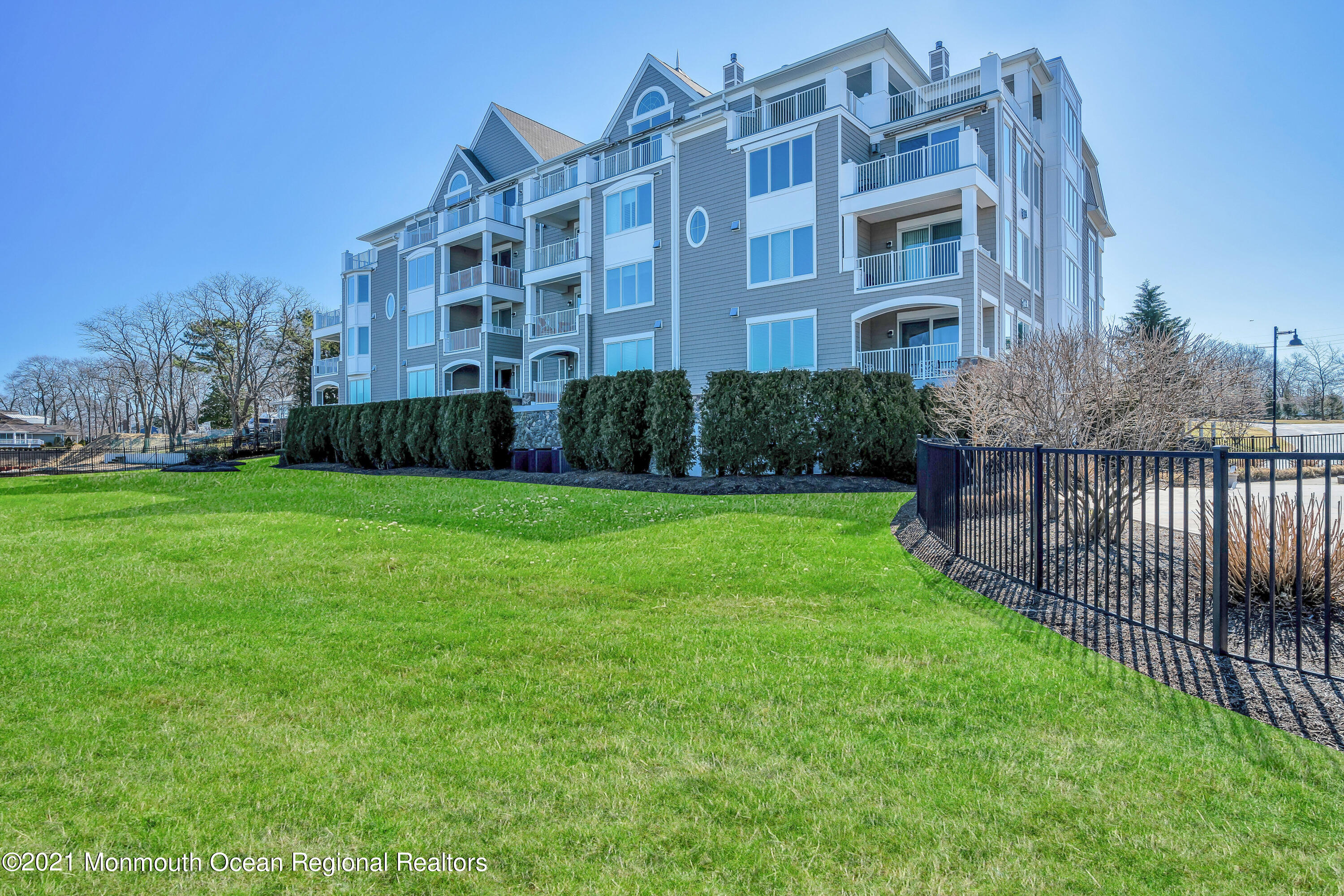 2201 River Road, Unit 3202 Point Pleasant, NJ 08742 - Photo 39 of 44 a view of a building with a yard