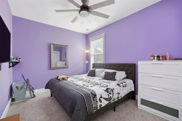 a bedroom with a bed and a dresser