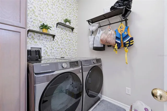 a utility room with dryer and washer