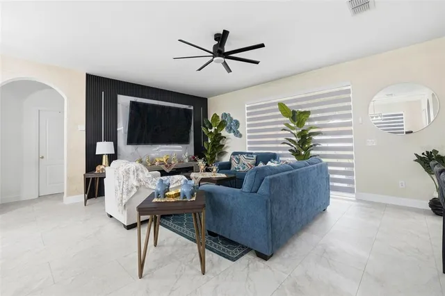 a living room with furniture and a flat screen tv
