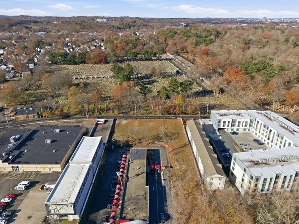 an aerial view of a balcony with chairs