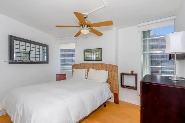 a bedroom with a bed and a cabinets