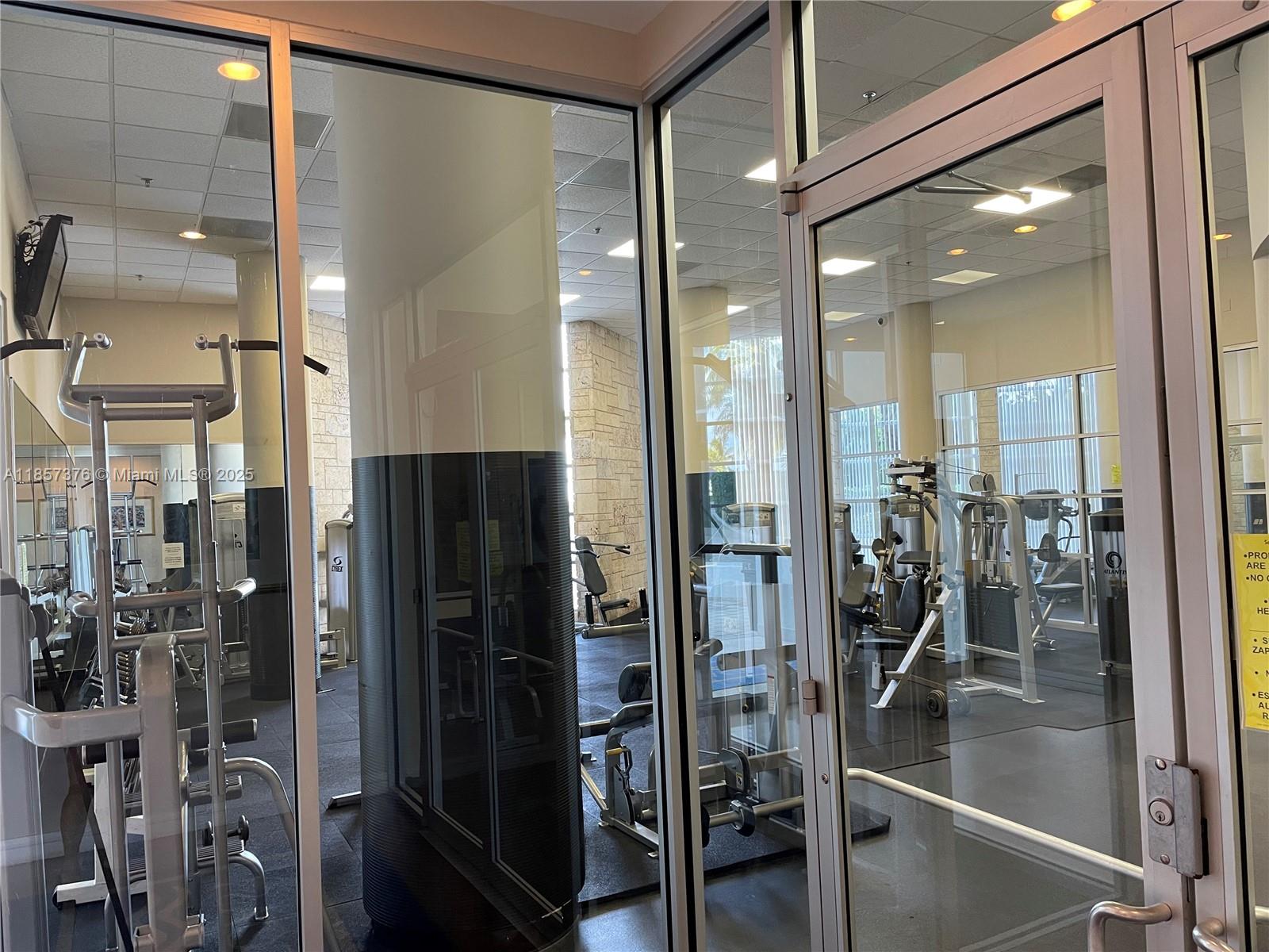 5161 Collins Avenue, Unit 1104 Miami Beach, FL 33140 - Photo 17 of 19 a bathroom with a glass shower door