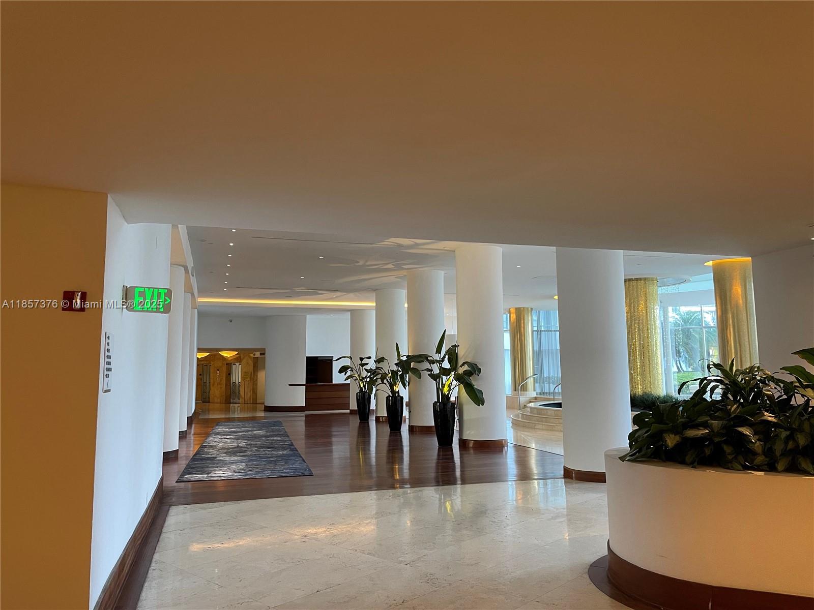 5161 Collins Avenue, Unit 1104 Miami Beach, FL 33140 - Photo 18 of 19 a view of a living room and dining room
