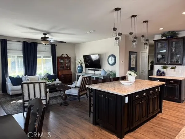 a large kitchen with a table and chairs
