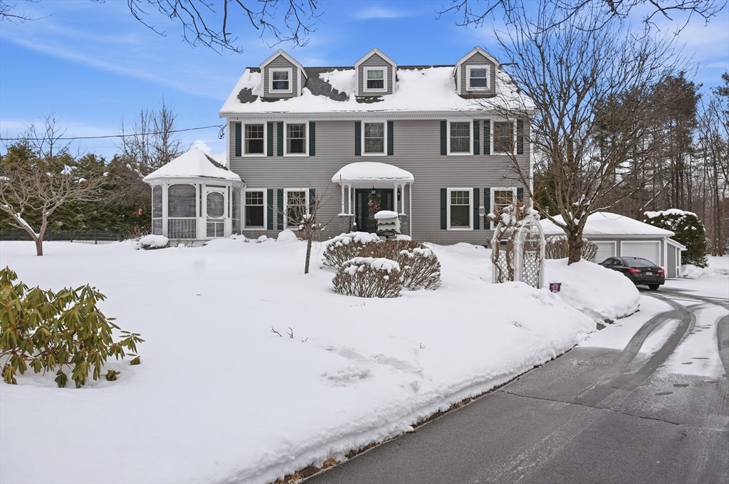 459 North Street Georgetown, MA 01833 - Photo 1 of 42 a front view of a house with yard covered in snow