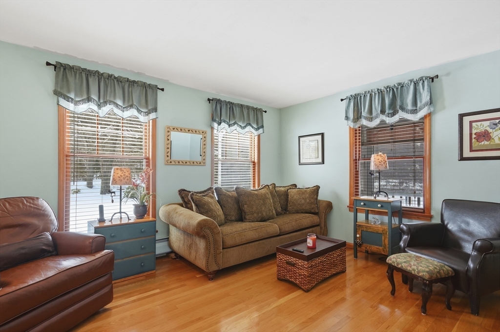 459 North Street Georgetown, MA 01833 - Photo 11 of 42 a living room with furniture and a large window