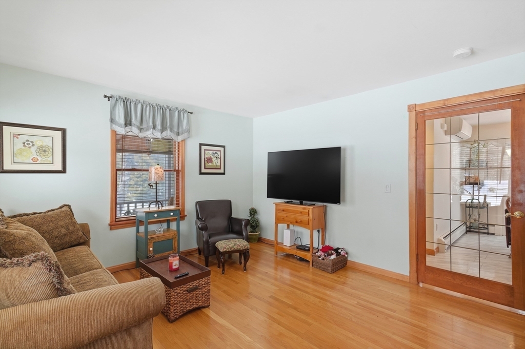 459 North Street Georgetown, MA 01833 - Photo 12 of 42 a living room with furniture and a flat screen tv