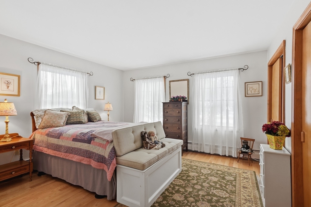 459 North Street Georgetown, MA 01833 - Photo 20 of 42 a bed room with a bed and a couch