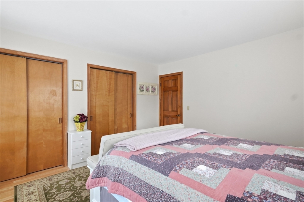 459 North Street Georgetown, MA 01833 - Photo 21 of 42 a bedroom with a bed and a dresser