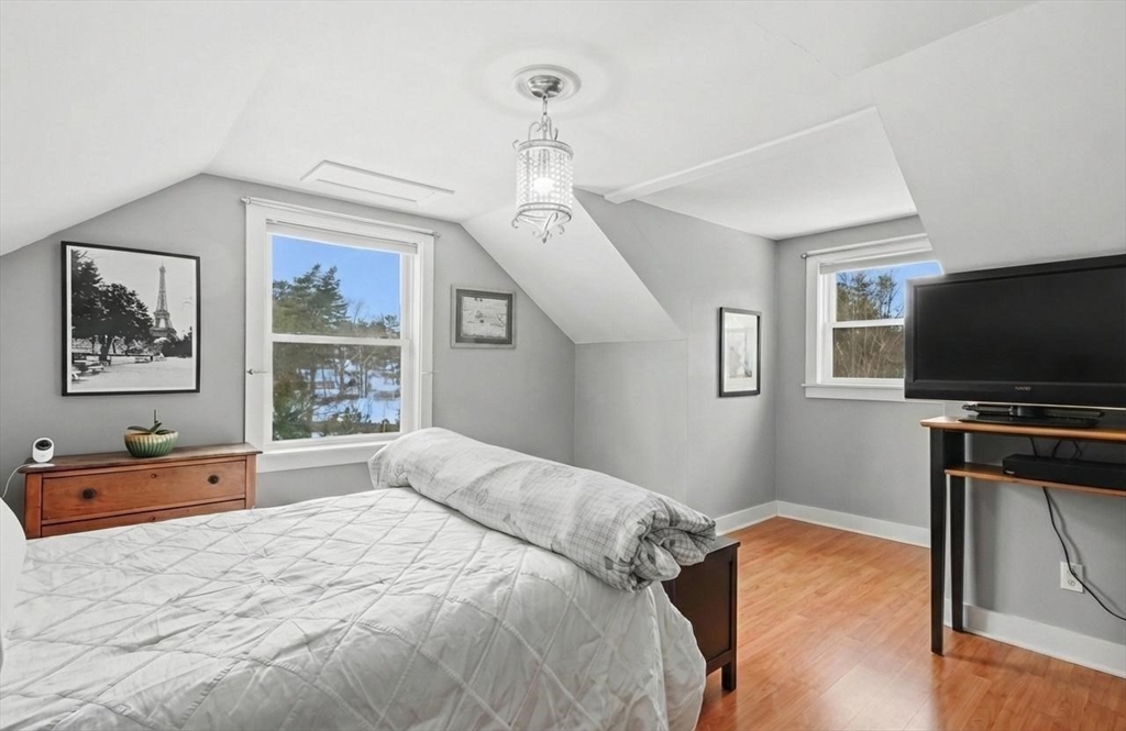459 North Street Georgetown, MA 01833 - Photo 26 of 42 a bedroom with a bed and a flat screen tv