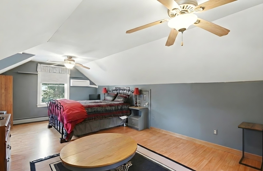 459 North Street Georgetown, MA 01833 - Photo 28 of 42 a living room with a bed furniture and a window