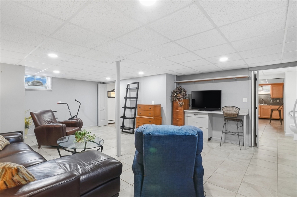 459 North Street Georgetown, MA 01833 - Photo 33 of 42 a living room with furniture and a flat screen tv
