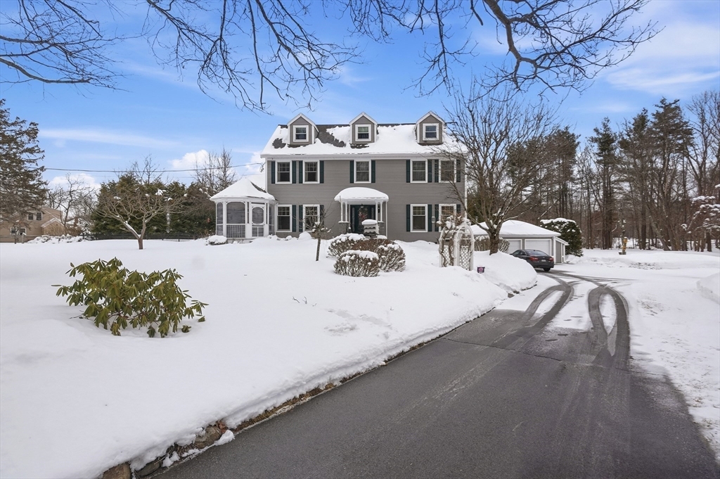 459 North Street Georgetown, MA 01833 - Photo 42 of 42 a view of a white house with a yard covered in snow