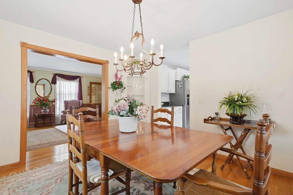 459 North Street Georgetown, MA 01833 - Photo 10 of 42 a view of a dining room with furniture and chandelier