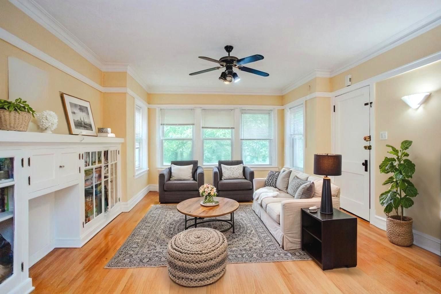 2453 North Tripp Avenue Chicago, IL 60639 - Photo 4 of 17 a living room with fireplace furniture and a large window