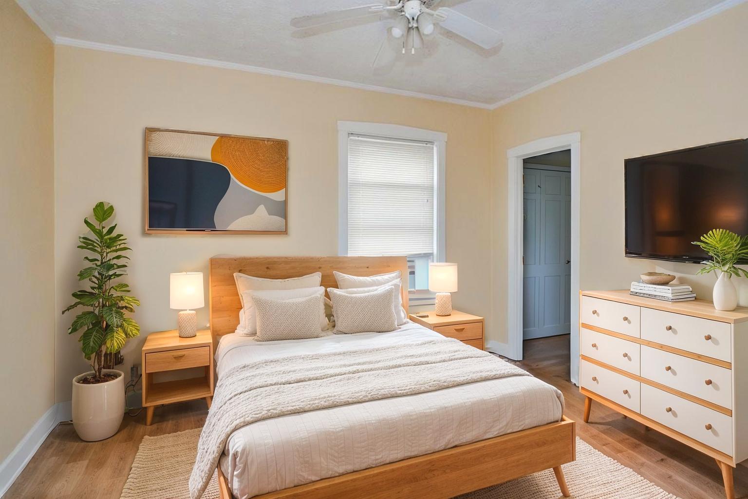 2453 North Tripp Avenue Chicago, IL 60639 - Photo 8 of 17 a bedroom with a bed and a potted plant