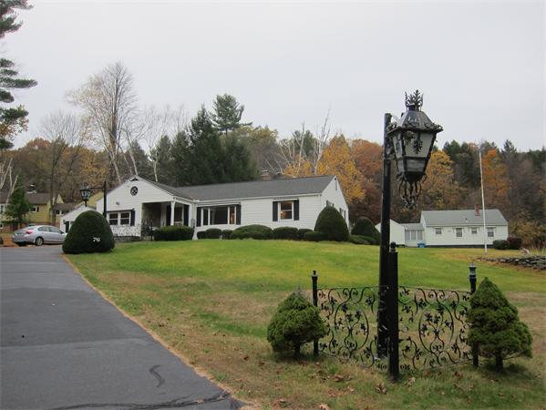 76 Ridgewood Drive Russell, MA 01071 - Photo 1 of 30 a front view of a house with garden