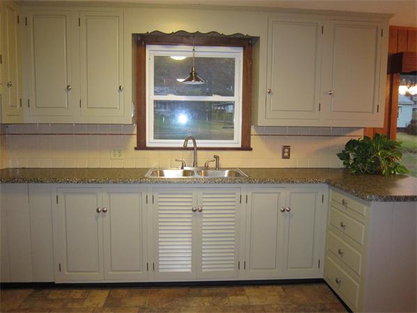 76 Ridgewood Drive Russell, MA 01071 - Photo 13 of 30 a kitchen with granite countertop white cabinets and sink