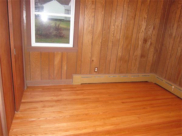 76 Ridgewood Drive Russell, MA 01071 - Photo 14 of 30 a view of empty room with wooden floor and fan