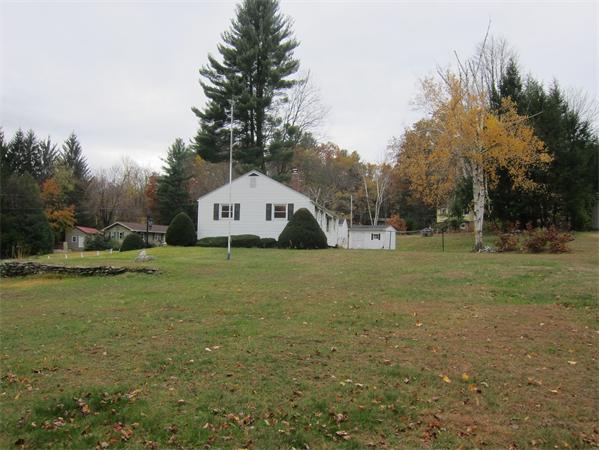 76 Ridgewood Drive Russell, MA 01071 - Photo 27 of 30 a front view of a house with garden