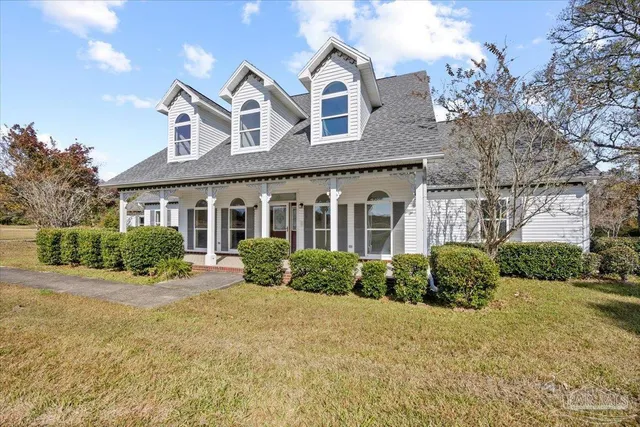 front view of a house with a yard
