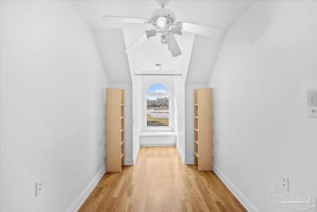 a view of a backyard with a small cabin and a chair