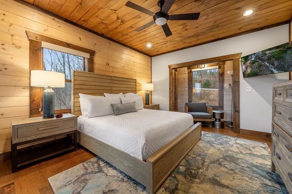 120 Riverview Drive Blue Ridge, GA 30513 - Photo 47 of 68 a bedroom with a bed and wooden floor