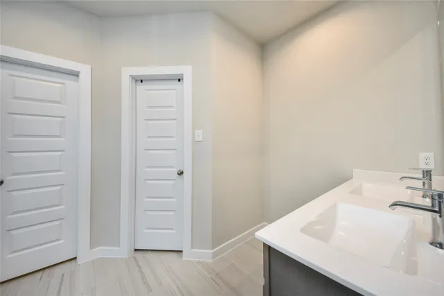 a bathroom with a sink and mirror