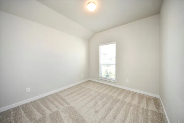 an empty room with closet area