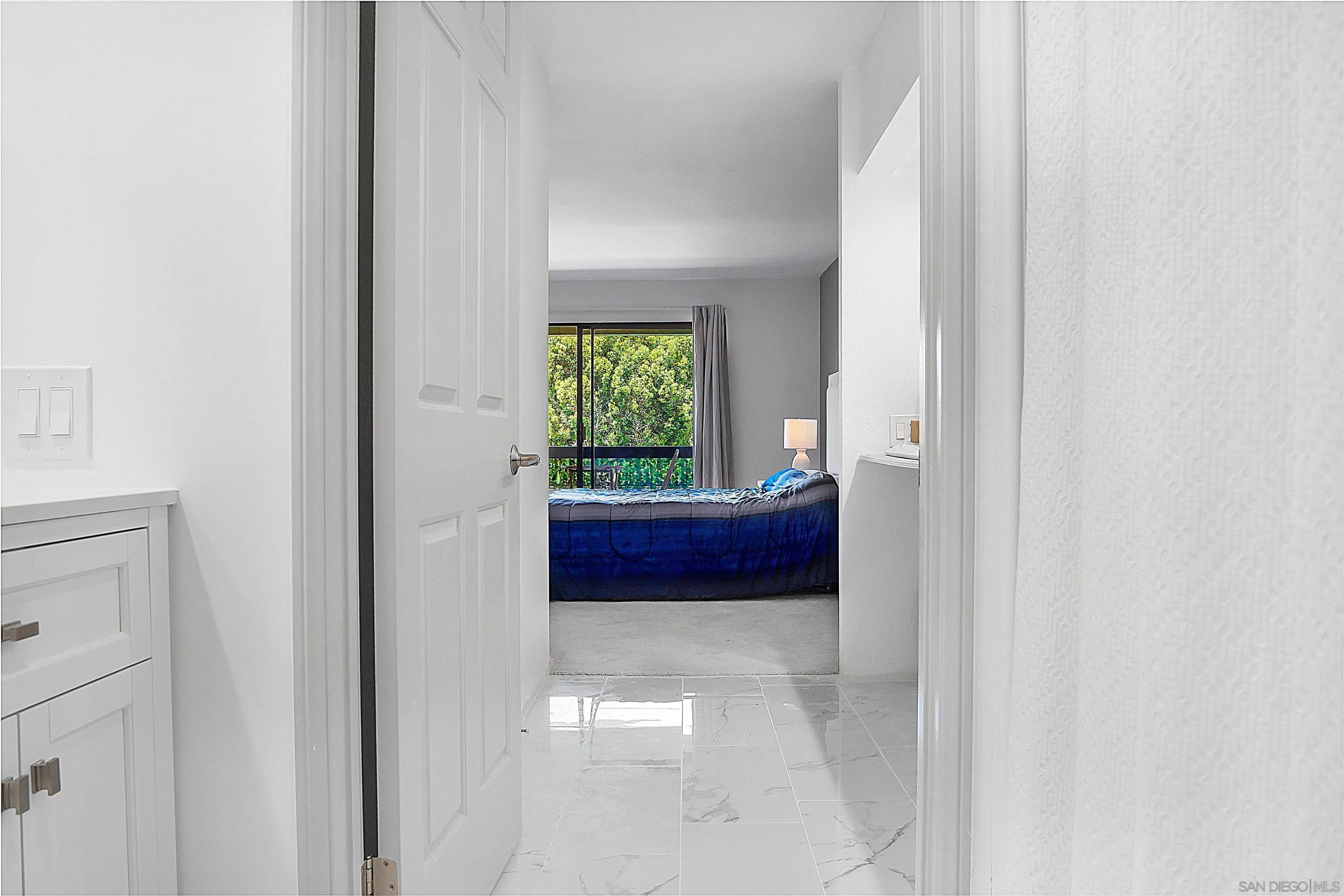 5605 Friars Road, Unit 304 San Diego, CA 92110 - Photo 12 of 37 a bathroom with mirror and window