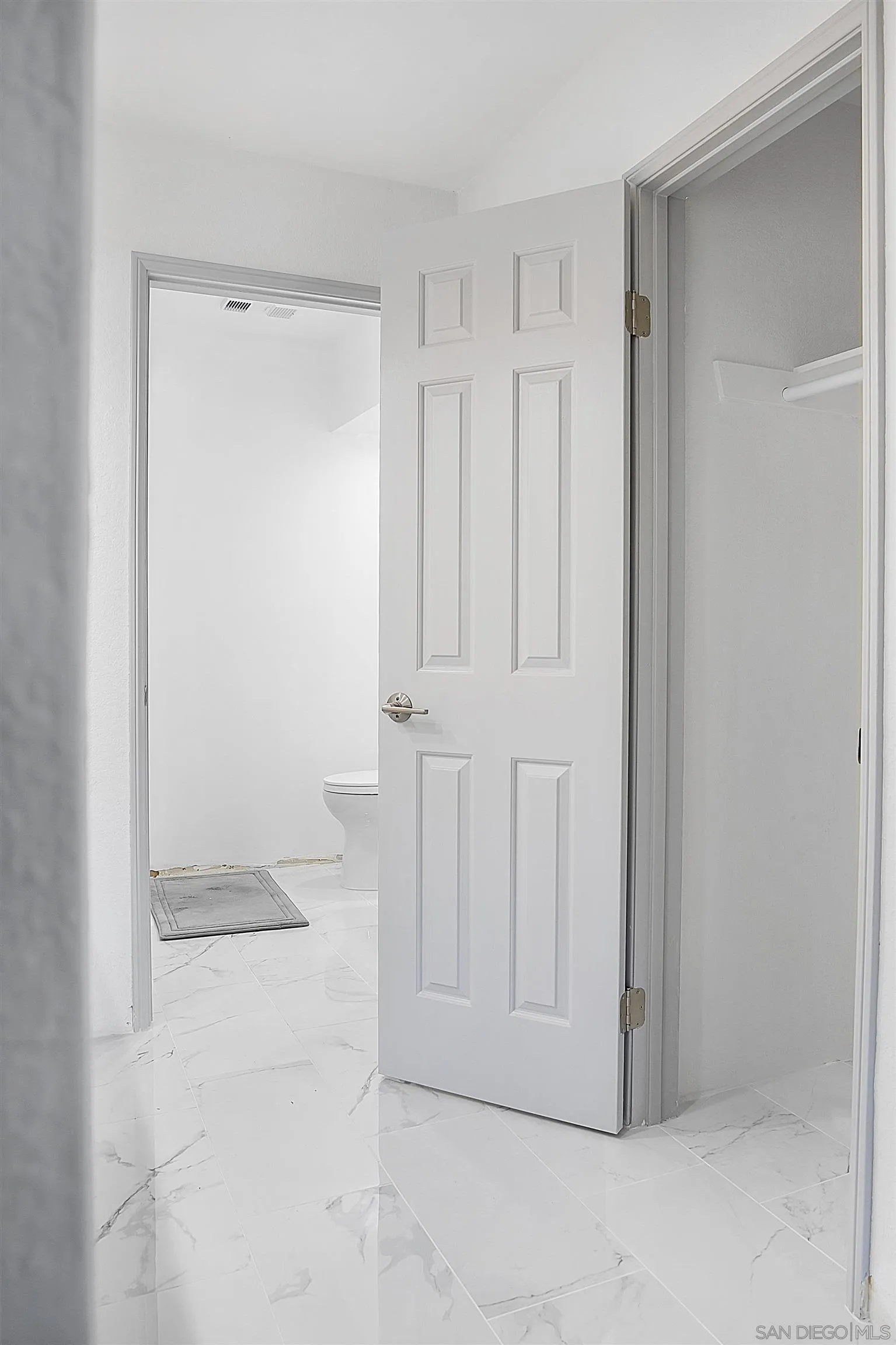 5605 Friars Road, Unit 304 San Diego, CA 92110 - Photo 14 of 37 an empty room with white door