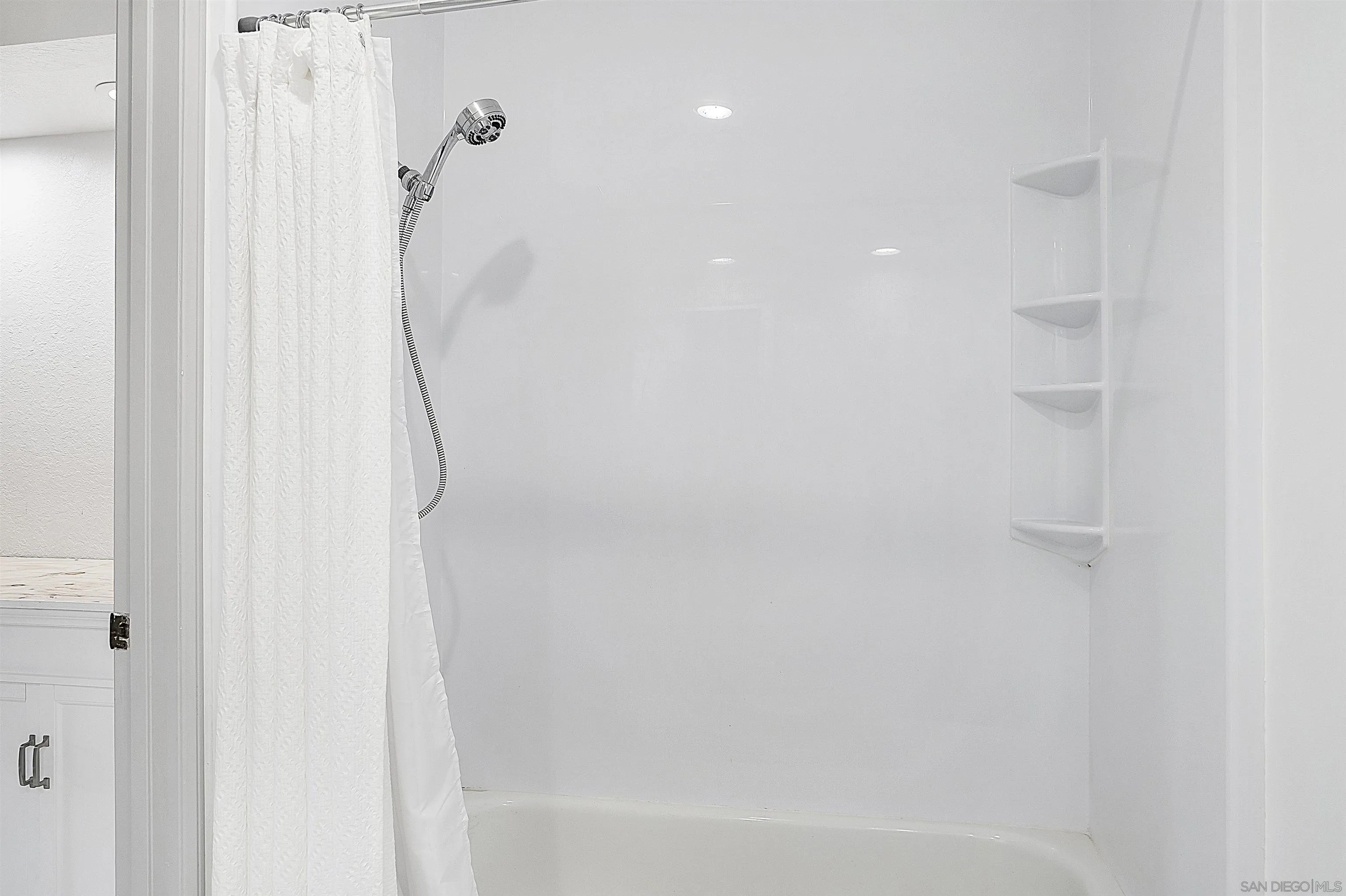 5605 Friars Road, Unit 304 San Diego, CA 92110 - Photo 16 of 37 a bathroom with a shower