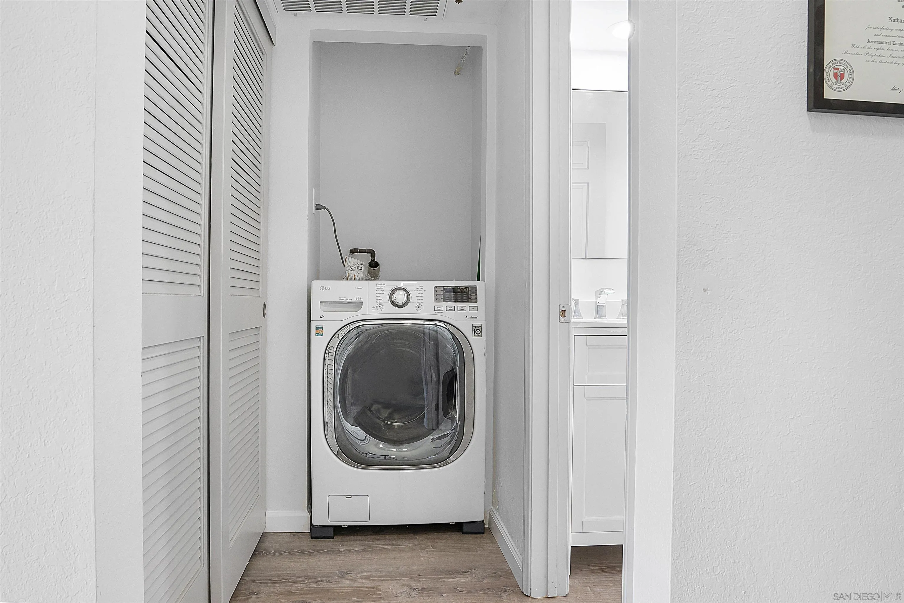 5605 Friars Road, Unit 304 San Diego, CA 92110 - Photo 17 of 37 a utility room with dryer and washer