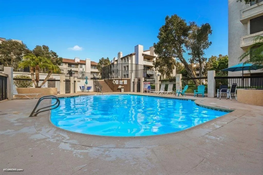5605 Friars Road, Unit 304 San Diego, CA 92110 - Photo 25 of 37 a view of a swimming pool with outdoor seating